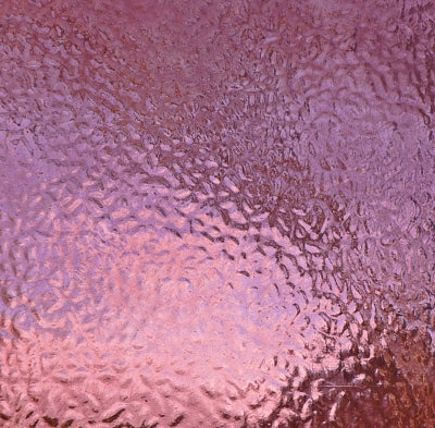 A close-up of a textured, hammered metallic surface with a pink and purple color gradient.