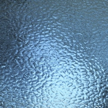 Textured frosted glass with a hammered or bubbled pattern, showing light blue and silver tones with a bright reflective center.