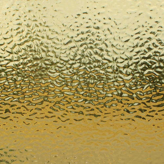 Textured gold frosted glass with a wavy, hammered pattern and a warm metallic sheen.