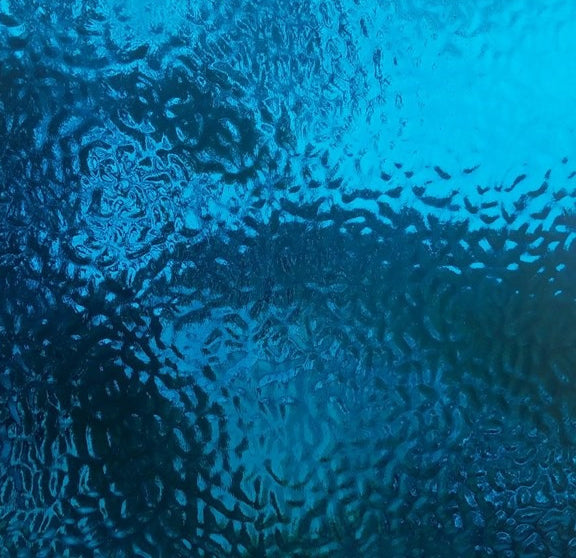 Textured blue frosted glass with a rippled, wavy pattern across the surface.